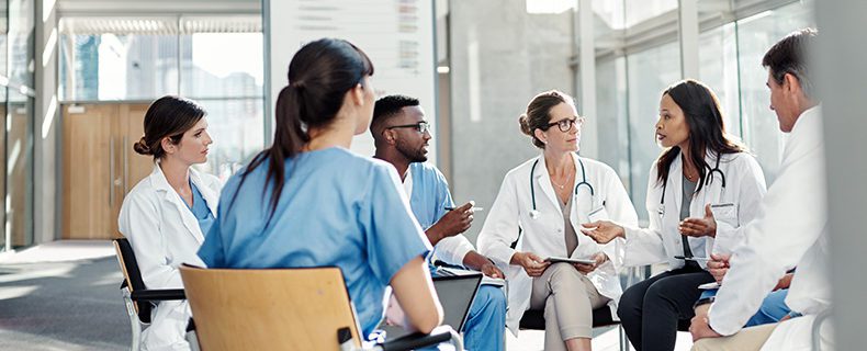 Doctors and nurses engaging in discussion