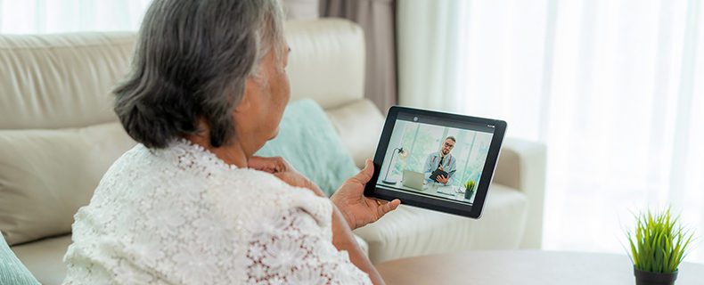 Patient uses telehealth app to talk to doctor.