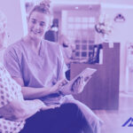 Clinician holding tablet with EHR software