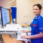 Nurse using EPR on computer