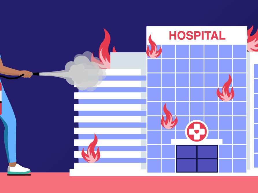 Nurse putting out fire in hospital building