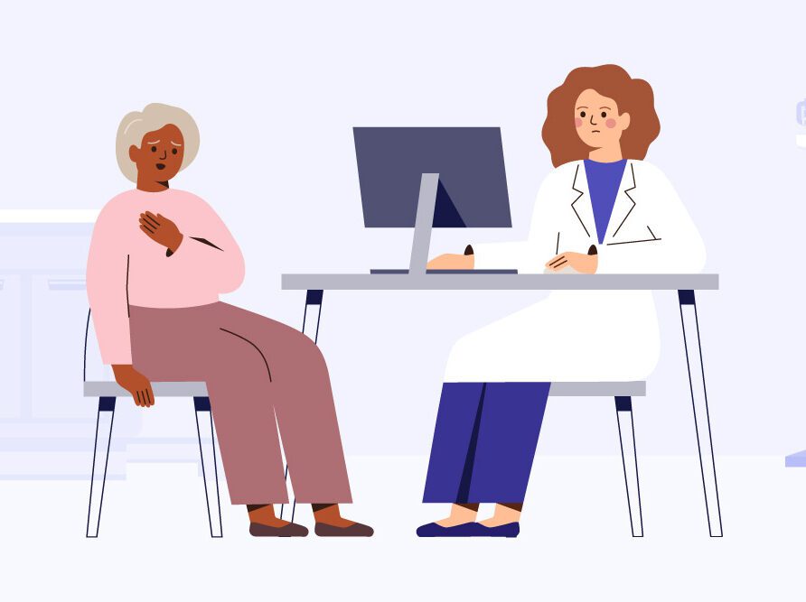 doctor and patient sitting at desk