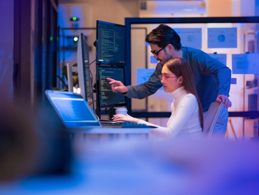 two people looking at computer screen